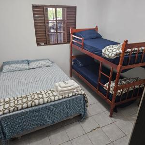 En eller flere senge i et værelse på Descanso perfeito em São Gabriel