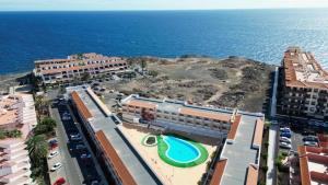 an aerial view of a resort near the ocean at 4 seasons relax apartment in Costa Del Silencio