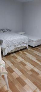 Postel nebo postele na pokoji v ubytování Hotel JRM