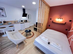 En eller flere senge i et værelse på Paris 21 - Studio charmant proche du centre-ville