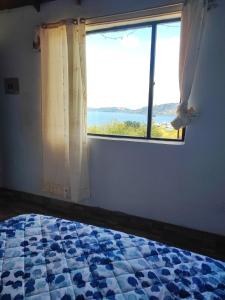 En eller flere senge i et værelse på Munay Tota Signature