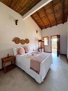 Postel nebo postele na pokoji v ubytování Pousada Aconchego