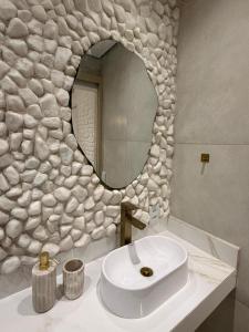 Et badeværelse på Kanga Suítes - Aquário