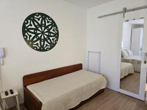 En eller flere senge i et værelse på Flat Privativo Rua das Pedras