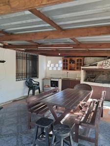 a large wooden table and chairs in a kitchen at Ebenezer in Playa Hermosa