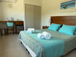 Postel nebo postele na pokoji v ubytování Hotel Victoria