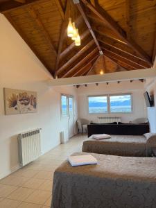 En eller flere senge i et værelse på Los Arboles Apart