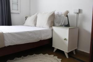 En eller flere senge i et værelse på Catalina House