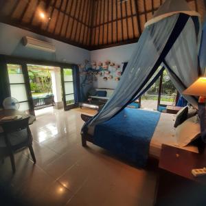 Postel nebo postele na pokoji v ubytování Villa Shantitara Bungalows