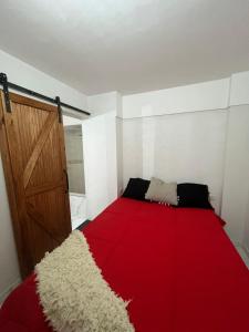 En eller flere senge i et værelse på Departamento Vicco