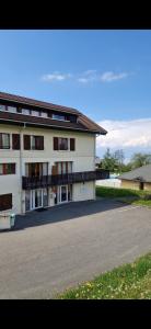 a large white building with a road in front of it at 2-room apartment with breathtaking views of Lake Geneva in Lugrin +10 photos