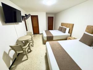 Postel nebo postele na pokoji v ubytování Hotel Pereira Central + 35 fotografií