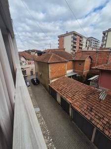 a view of a city street with buildings and roofs at Nice apartment at the center of Vushtrri city in Mitrovicë