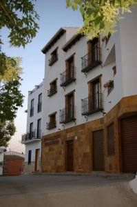 a building with balconies on the side of it at Villa de Xicar in Montejicar