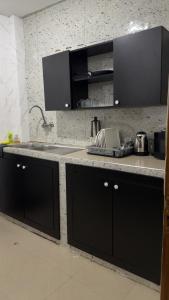 Kuchyň nebo kuchyňský kout v ubytování Serenity by Feliho House