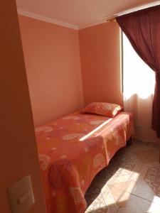 Giường trong phòng chung tại Condominio Palermo