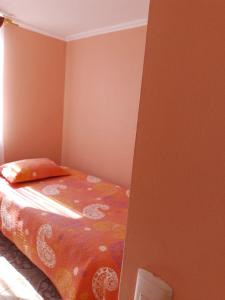 Giường trong phòng chung tại Condominio Palermo