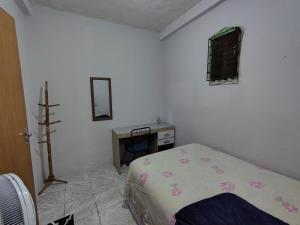 Ένα ή περισσότερα κρεβάτια σε δωμάτιο στο Casa quarto dormitório estudantil em salobrinho para uescquianos