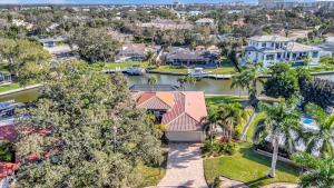 an aerial view of a house with palm trees at Siesta Key Beach Waterfront Home with Kayaks and Bikes in Siesta Key
