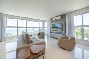 Et tv og/eller underholdning på Riviera Duplex 3 Suítes by Achei Camboriú