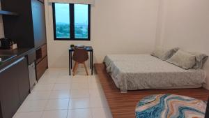 En eller flere senge i et værelse på Alor Setar Imperio Studio by IM Staycation