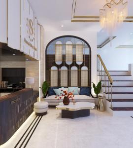 a living room with a couch and a table at Sky Charm Hanoi Hotel and Spa in Hanoi