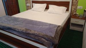 Postel nebo postele na pokoji v ubytování Tree Heaven Homestay