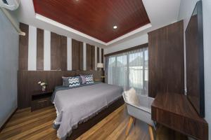 Giường trong phòng chung tại Arterra Haven Aonang Krabi