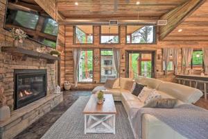 a living room with a couch and a fireplace at Moonlight Trail in Broken Bow
