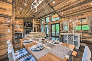 a dining room and living room with a table and chairs at Moonlight Trail in Broken Bow