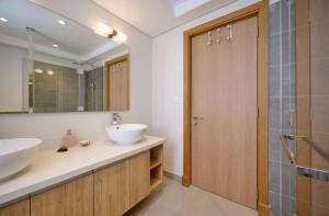 a bathroom with a sink and a mirror at Residence ORYAM in Trou aux Biches +15 photos