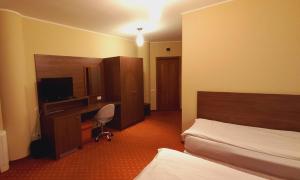 Телевизор и/или развлекательный центр в Hotel Hermes