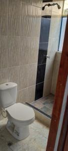 Et badeværelse på casa de hospedaje urcunina