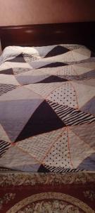 En eller flere senge i et værelse på casa de hospedaje urcunina