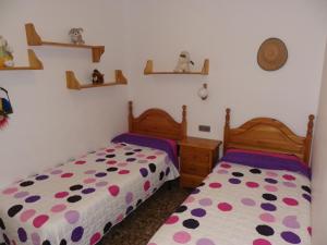 two beds in a room with at Azahara in Lloret de Mar +10 photos