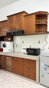 Køkken eller tekøkken på Mimi Homestay Tanjong Malim