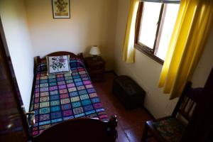 A bed or beds in a room at Casa Rural de Tío Félix