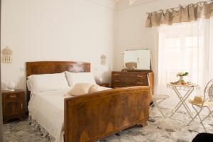 Rúm í herbergi á Dimora Cappuccini Guest House