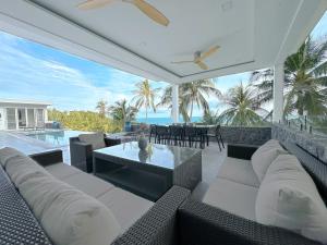 a living room with a couch and a table at Villa Nice in Lamai