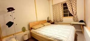 Postel nebo postele na pokoji v ubytování 沐時光民宿