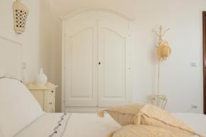 Rúm í herbergi á Dimora Cappuccini Guest House