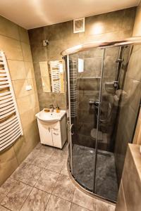 Kúpeľňa v ubytovaní Słoneczna Osada - komfortowe domki