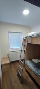 Postel nebo postele na pokoji v ubytování Apartma Mlinca 2