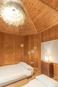 Postel nebo postele na pokoji v ubytování 감성제주스테이