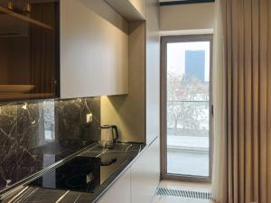 Kuchyň nebo kuchyňský kout v ubytování Royal City Stays + 23 fotografií