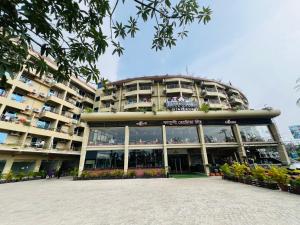 a large building with a lot of windows at Hotel Kollol by J&Z Group in Cox's Bazar