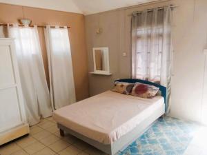 Postel nebo postele na pokoji v ubytování palmiste villa