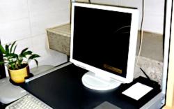 a computer monitor sitting on top of a desk at Hotel Crown Hills Yuki in Yuki