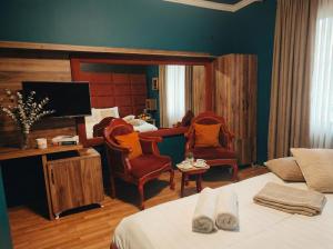 TV a/nebo společenská místnost v ubytování Urban Artist