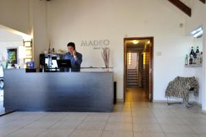Area lobi atau resepsionis di Madeo Hotel & Spa